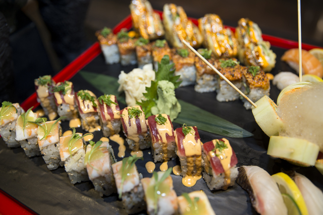 The Godzilla Platter, served with five different sushi rolls that include the tempura roll, tiger roll, girl on the beach roll, el chapo roll, and rok & roll, and four type of nigiri that incl ...