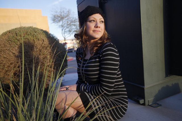 Stacy Cerame wears a wig from the wig closet in the parking lot of the American Cancer Society on Monday, Feb.13, 2017, in Las Vegas. Cerame was diagnosed with breast cancer in October, had surger ...