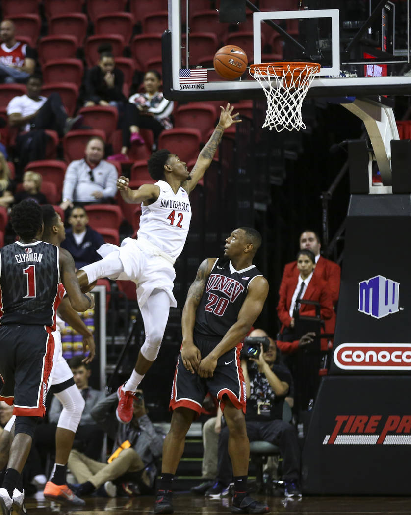 San Diego State guard Jeremy Hemsley (42) goes to the basket over UNLV forward Christian Jones (20) during a Mountain West Conference tournament basketball game at the Thomas & Mack Center in  ...