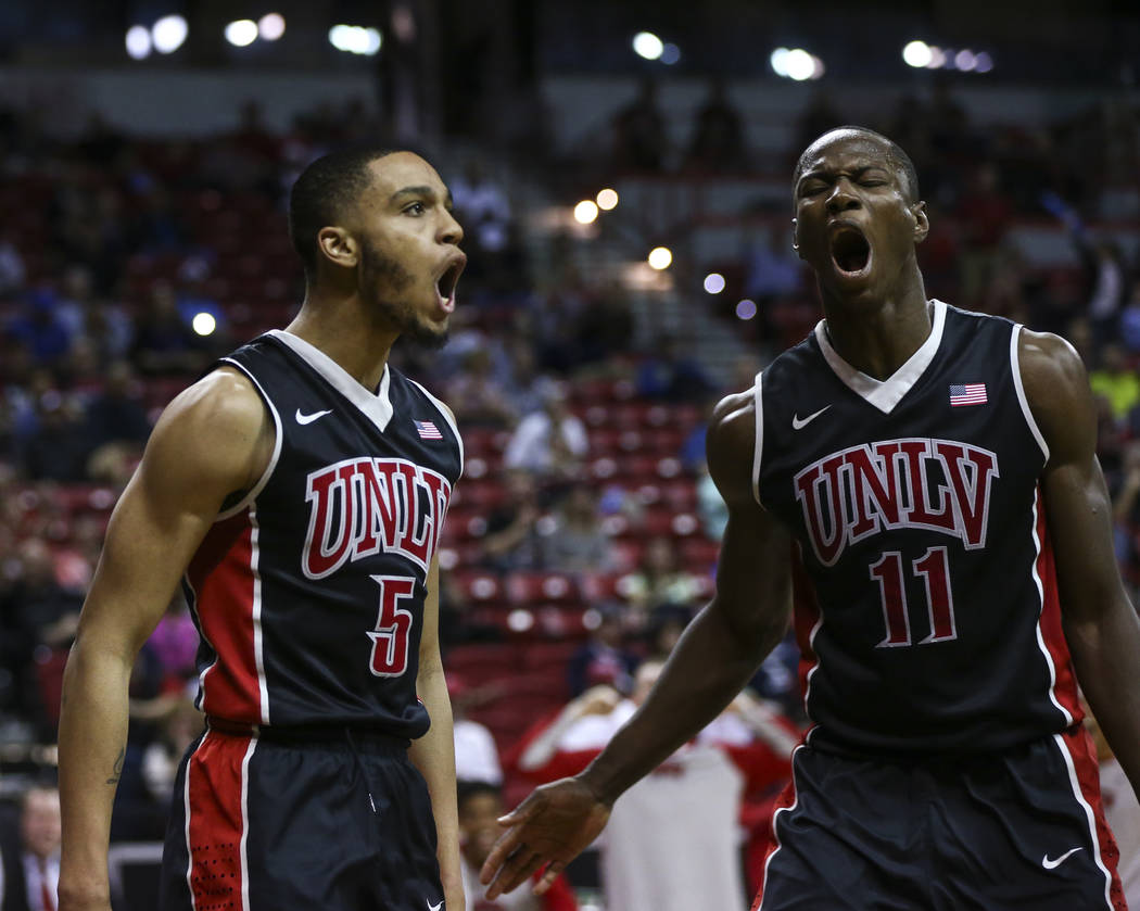 UNLV guard Jalen Poyser (5) and UNLV forward Cheickna Dembele (11) react while playing San Diego State during a Mountain West Conference tournament basketball game at the Thomas & Mack Center  ...