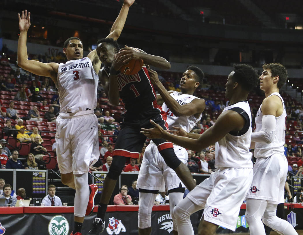 UNLV guard Kris Clyburn (1) gets a rebound while surrounded by San Diego State players during a Mountain West Conference tournament basketball game at the Thomas & Mack Center in Las Vegas on  ...