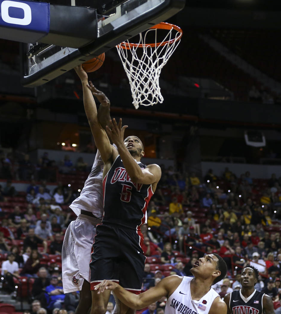 UNLV guard Jalen Poyser (5) goes to the basket over San Diego State during a Mountain West Conference tournament basketball game at the Thomas & Mack Center in Las Vegas on Wednesday, March 8, ...