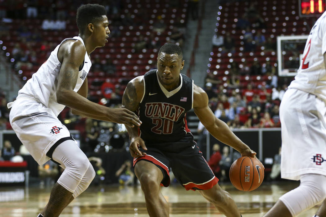 UNLV forward Christian Jones (20) drives against San Diego State during a Mountain West Conference tournament basketball game at the Thomas & Mack Center in Las Vegas on Wednesday, March 8, 20 ...