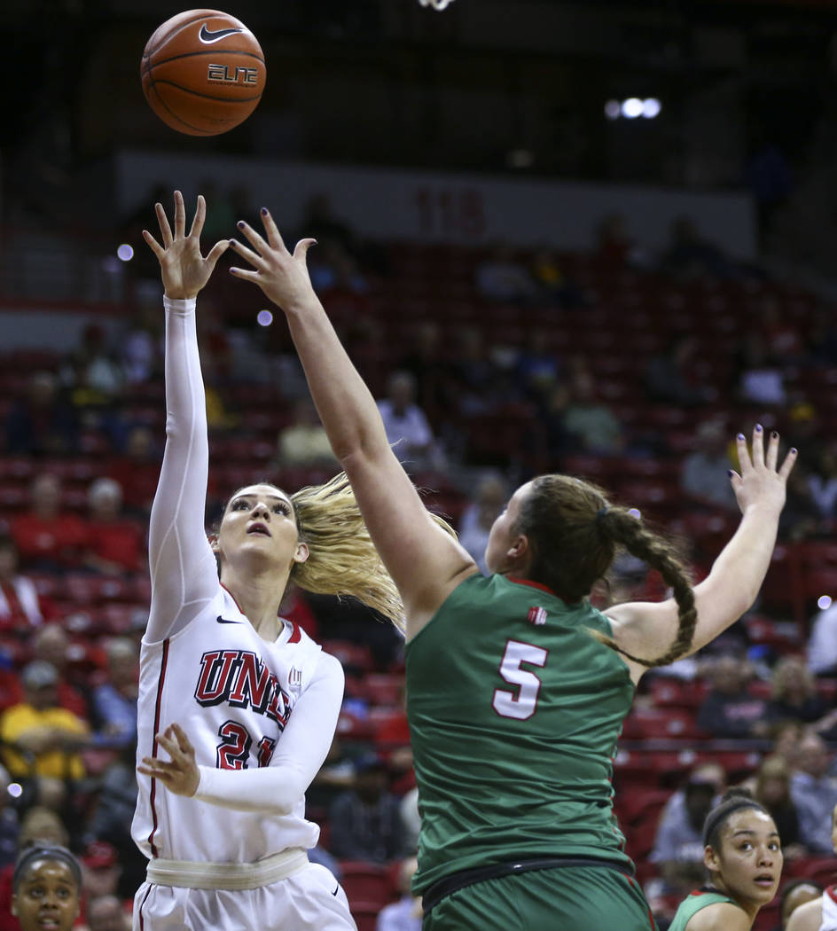 UNLV center Katie Powell (21) shoots over Fresno State center Katelin Noyer (5) during the Mountain West Conference basketball tournament at the Thomas & Mack Center in Las Vegas on Wednesday, ...