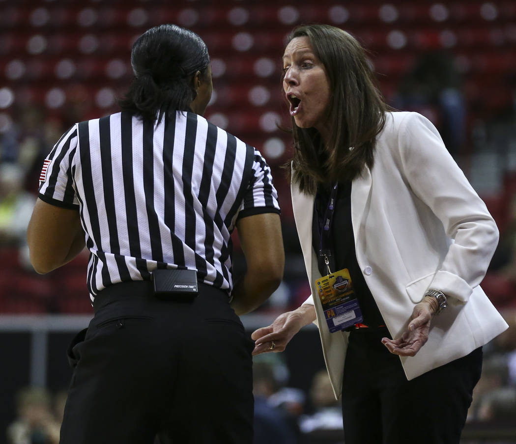 UNLV head coach Kathy Olivier questions a referee during a Mountain West Conference basketball tournament game against Fresno State at the Thomas & Mack Center in Las Vegas on Wednesday, March ...