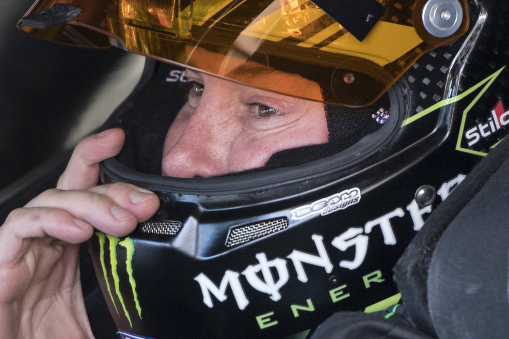 Driver Kurt Busch adjust his helmut before going on the track during practice for the NASCAR Monster Energy Cup auto race at Atlanta Motor Speedway in Hampton, Ga., Friday, March 3, 2017. (John Am ...