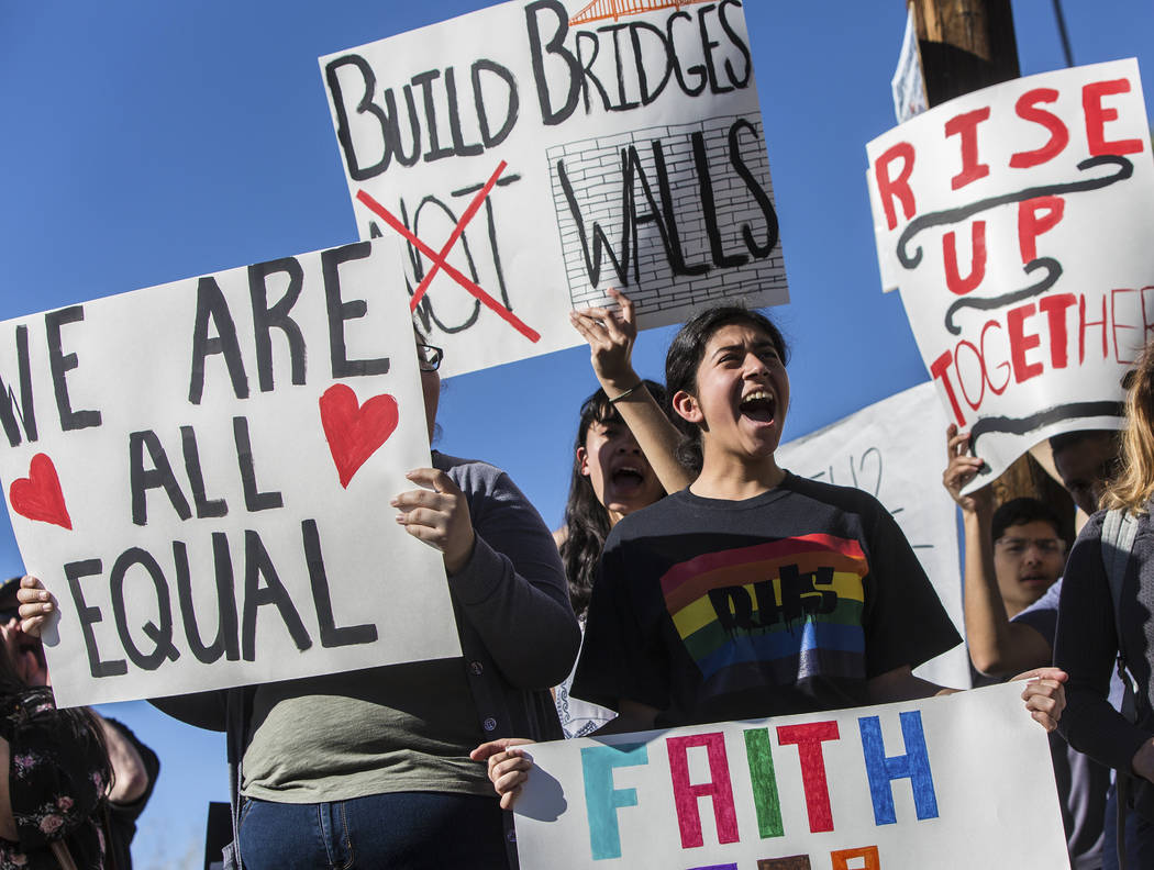 Dalia Becerra, right, cheers during a student rally in support of the BRIDGE Act on Tuesday, March 7, 2017, outside Rancho High School, in Las Vegas. The BRIDGE Act would provide Dreamers with a w ...