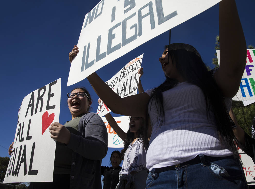 Mariana Espinoza-Zavala, left, cheers while holding a sign supporting the BRIDGE Act on Tuesday, March 7, 2017, outside Rancho High School, in Las Vegas. The BRIDGE Act would provide Dreamers with ...