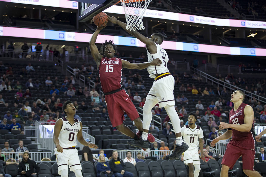 Stanford Cardinal guard Marcus Allen (15) is blocked by Arizona State Sun Devils forward Obinna Oleka (5) in the Pac-12 Men's Basketball Tournament game at T-Mobile Arena on Wednesday, March 8, 20 ...