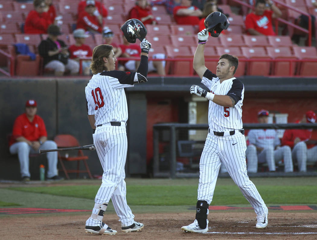 UNLV infielder Kyle Isbel (5) celebrates his home run with UNLV infielder Bryson Stott (10) during a baseball game against New Mexico at Wilson Stadium in Las Vegas on Friday, March 24, 2017. (Cha ...