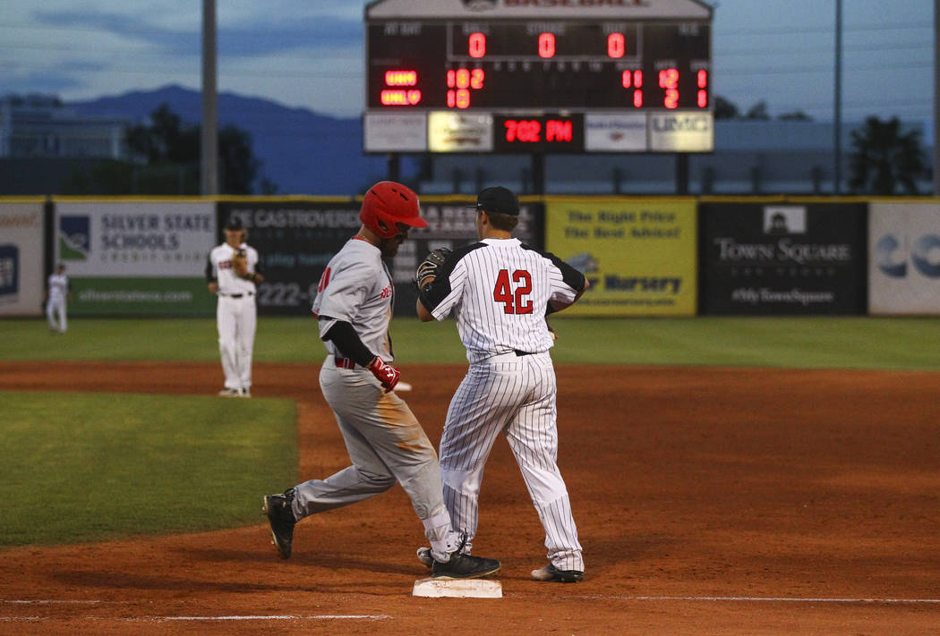 New Mexico infielder Jack Zoellner (28) gets tagged out by UNLV infielder Nick Ames (42) at first base during a baseball game at Wilson Stadium in Las Vegas on Friday, March 24, 2017. (Chase Steve ...