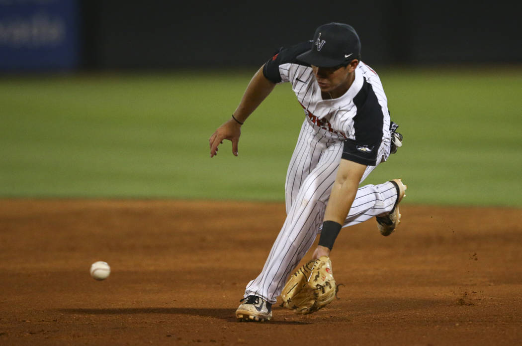 UNLV infielder Justin Jones (2) fields a hit from New Mexico infielder Jack Zoellner (28) for the out during a baseball game at Wilson Stadium in Las Vegas on Friday, March 24, 2017. (Chase Steven ...
