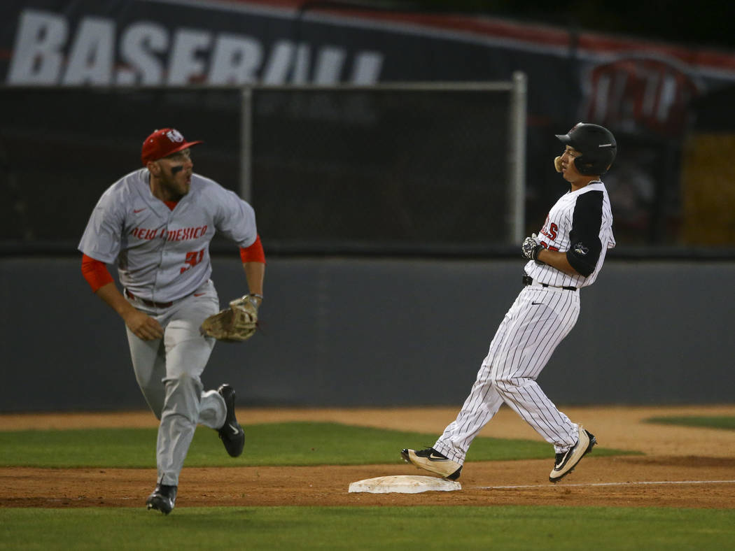 UNLV outfielder Ernie De La Trinidad (25) makes it to third base against New Mexico infielder Carl Stajduhar (30) during a baseball game at Wilson Stadium in Las Vegas on Friday, March 24, 2017. ( ...