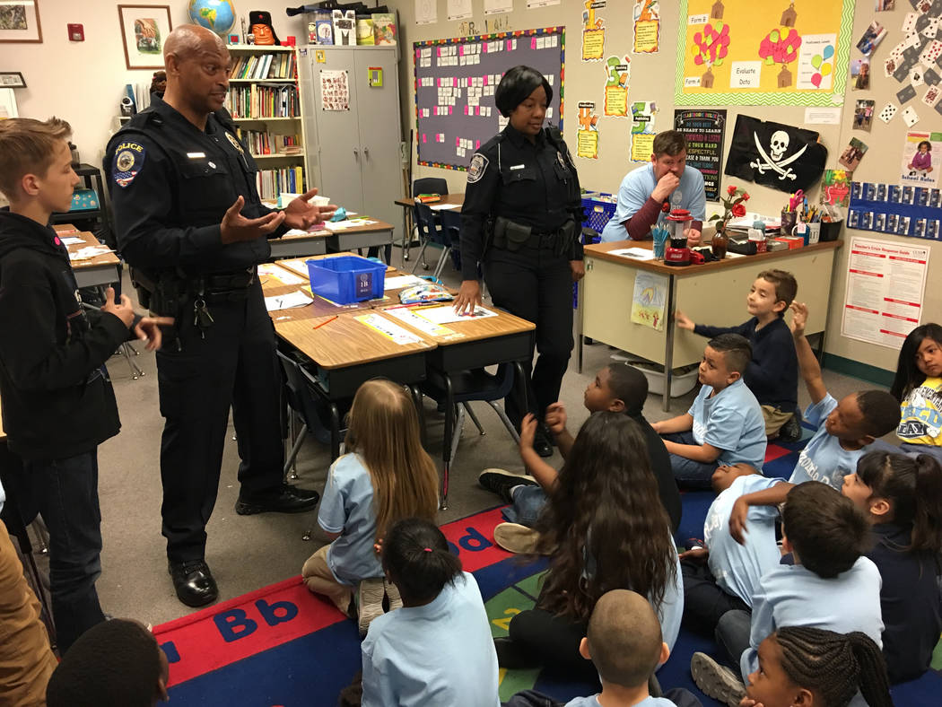 Clark County School District and North Las Vegas police officers speak to a first grade class at Raul P. Elizondo Elementary School in North Las Vegas, Wednesday, March 8, 2017. North Las Vegas fa ...