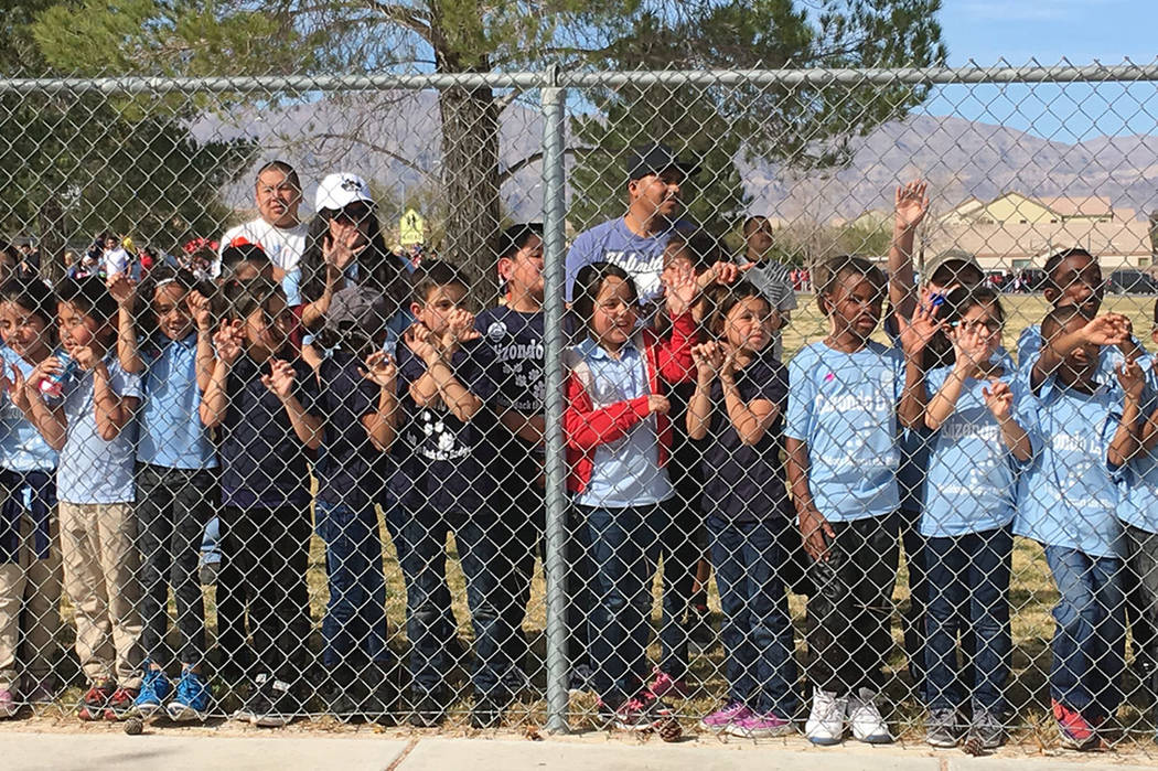 Raul P. Elizondo Elementary School students and parents watch the parade in memory of North Las Vegas fallen officer Raul P. Elizondo in North Las Vegas, Wednesday, March 8, 2017. Officer Elizondo ...