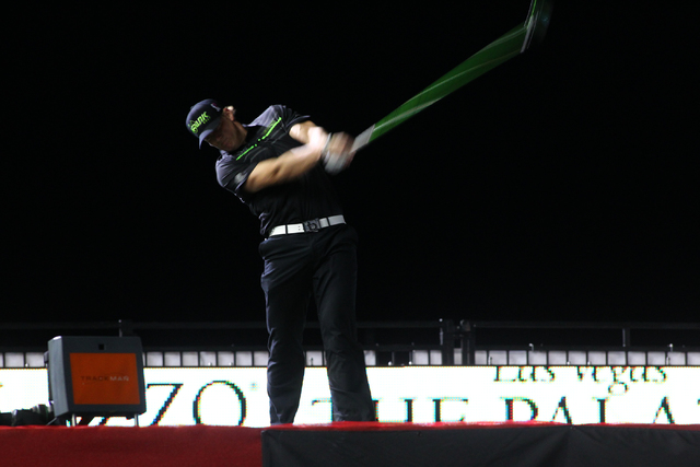 Tim Burke drives the ball in the semifinals of the RE/MAX Long Drive World Championship at the Las Vegas Motor Speedway on Wednesday, Oct. 30, 2013. Burke won the championship, defeating Miller. ( ...