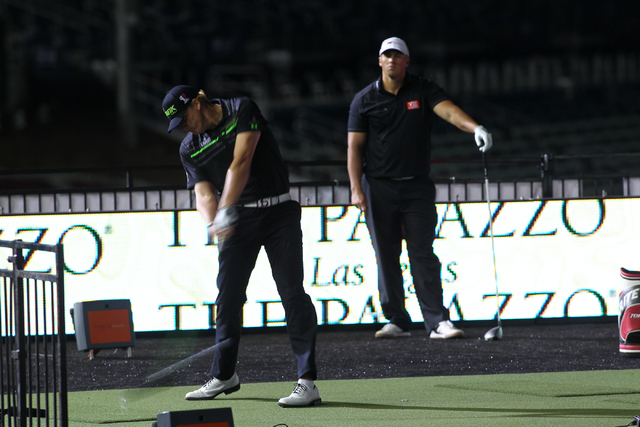 Tim Burke drives the ball while competing against Joe Miller in the final round of the RE/MAX Long Drive World Championship at the Las Vegas Motor Speedway on Wednesday, Oct. 30, 2013. Burke won t ...