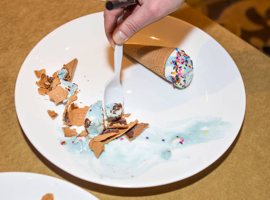 Attendees of the Ice Cream Technology Conference, sample a birthday cake cone ice cream flavor apart of an innovative flavor contest during the convention at the Hilton Lake Las Vegas Resort & ...