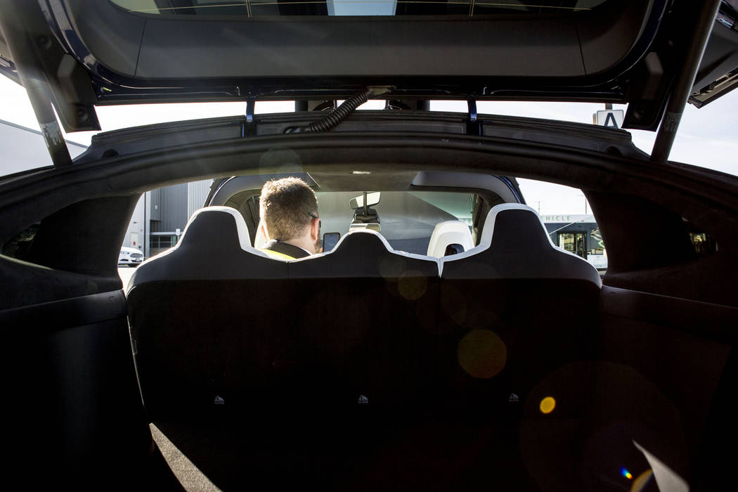Daniel Fazekas, senior regional planner of Southern Nevada Strong, sits in a Model X Tesla SUV crossover at the Regional Transportation Commission of Southern Nevada  raining Center, Wednesday, Ma ...