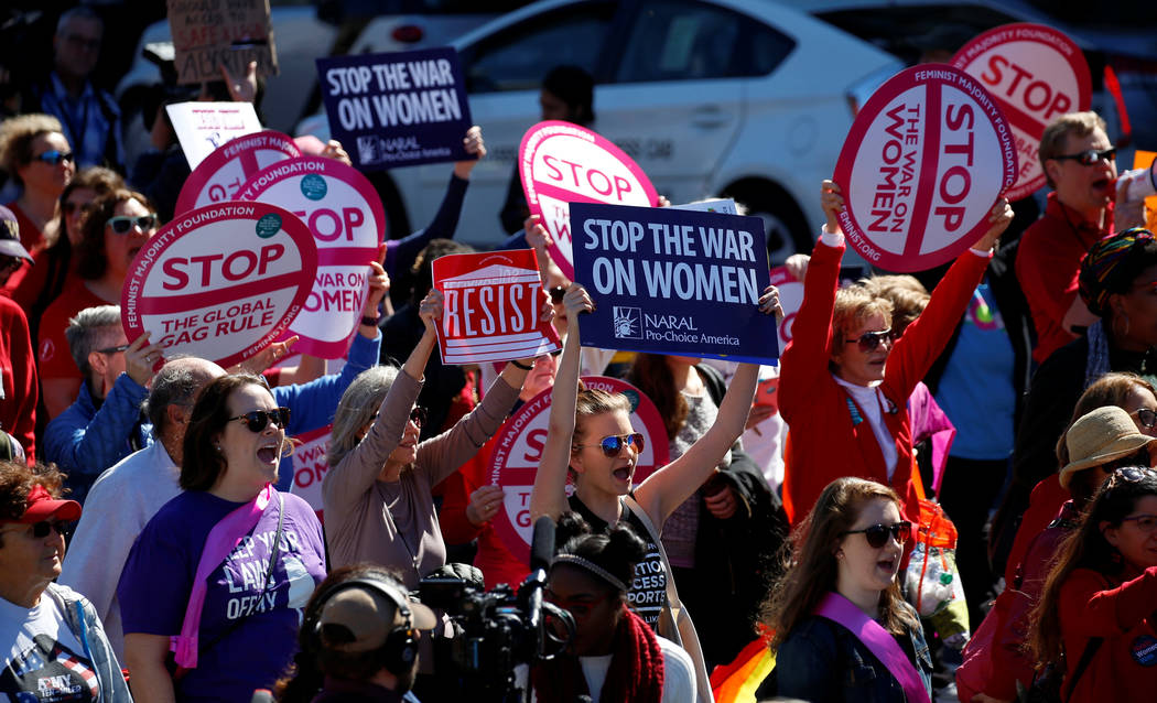 Activists march to the White House as part of "A Day Without a Woman" strike on International Women's Day in Washington, U.S., March 8, 2017. (Kevin Lamarque/Reuters)