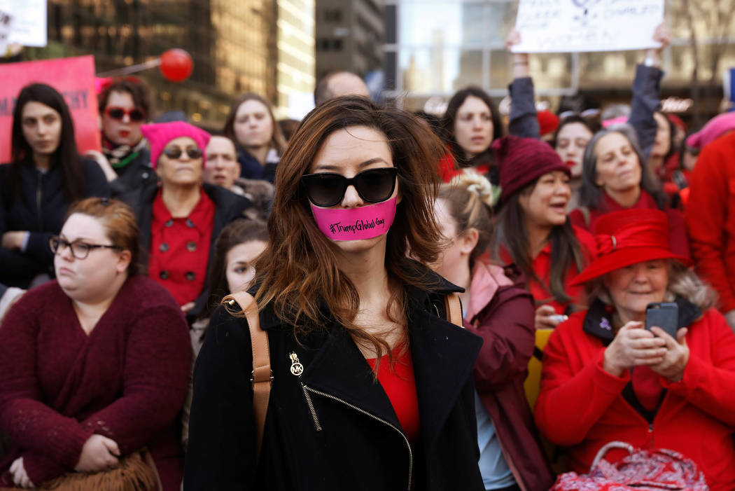 A woman with tape over her mouth takes part in a 'Day Without a Woman' march on International Women's Day in New York, U.S., March 8, 2017. (Lucas Jackson/Reuters)