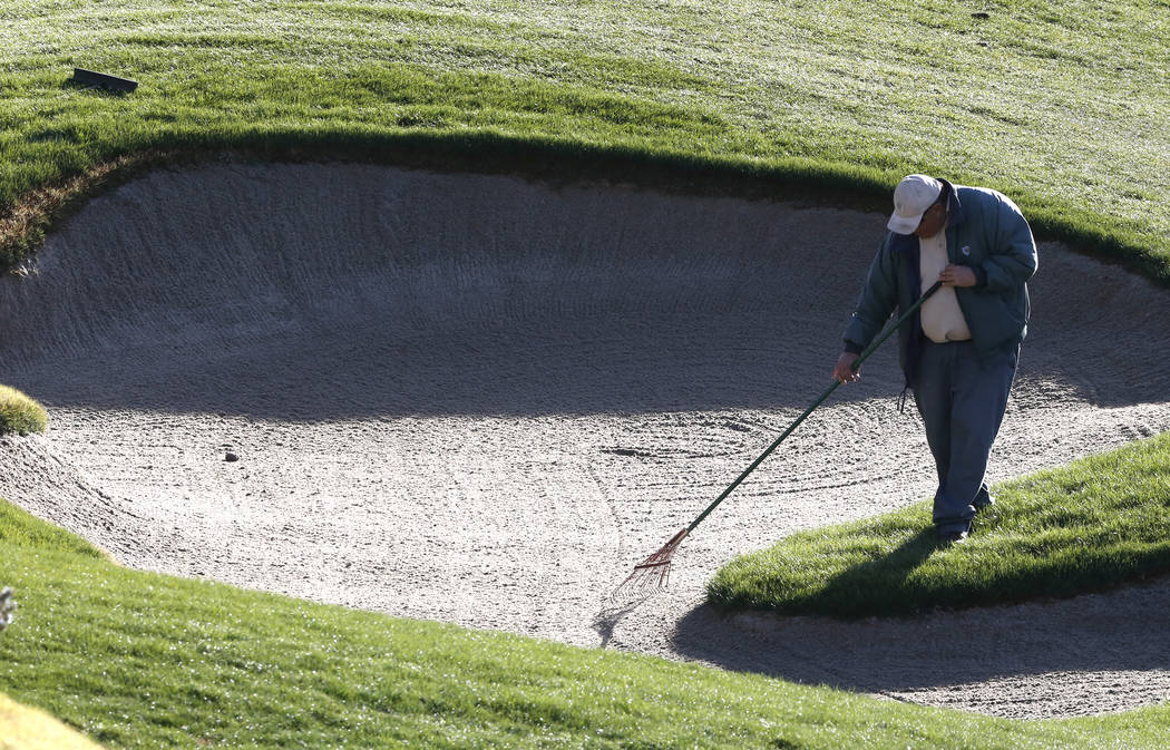 A worker gets a sand trap ready on Wednesday, March 8, 2017, at Southern Highland Golf Club in Las Vegas. (Bizuayehu Tesfaye/Las Vegas Review-Journal) @bizutesfaye
