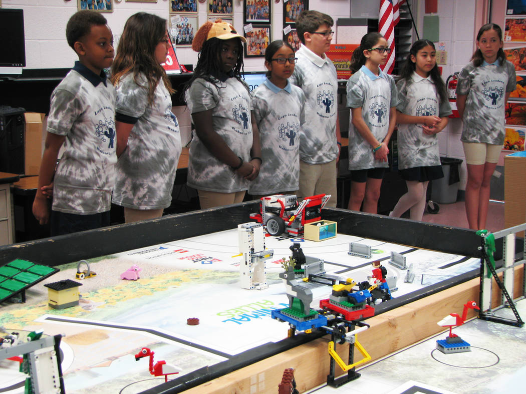 Members of the Jo Mackey Academy of Leadership and Global Communication through Technology Lego Leaders team practice a presentation about their research project on a proposed pet GPS on March 9,  ...