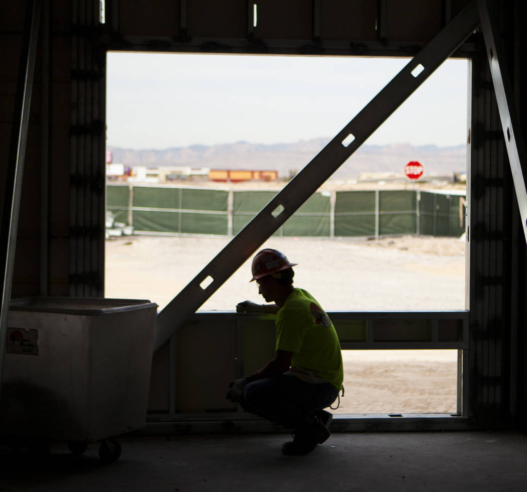 A construction worker works on the new 6-story hotel for the United Brotherhood of Carpenters union's training campus near McCarran International Airport in Las Vegas on Friday, March 10, 2017. Mi ...
