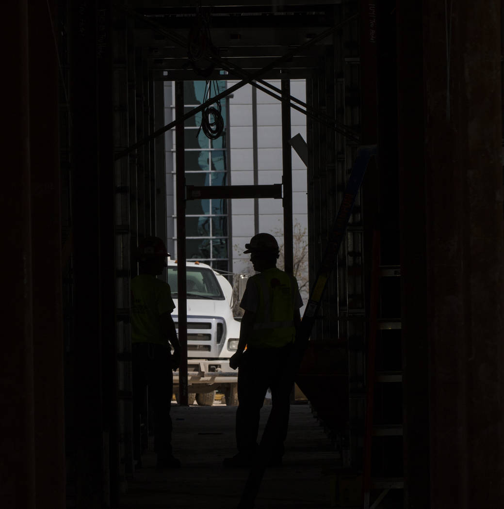 A construction worker walks through the interior of the new 6-story hotel for the United Brotherhood of Carpenters union's training campus near McCarran International Airport in Las Vegas on Frida ...