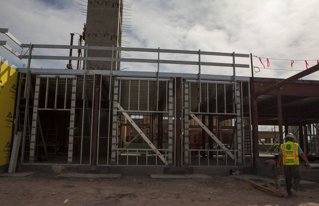 Construction workers    while working on the new 6-story hotel for the United Brotherhood of Carpenters union's training campus near McCarran International Airport in Las Vegas on Friday, March 10 ...