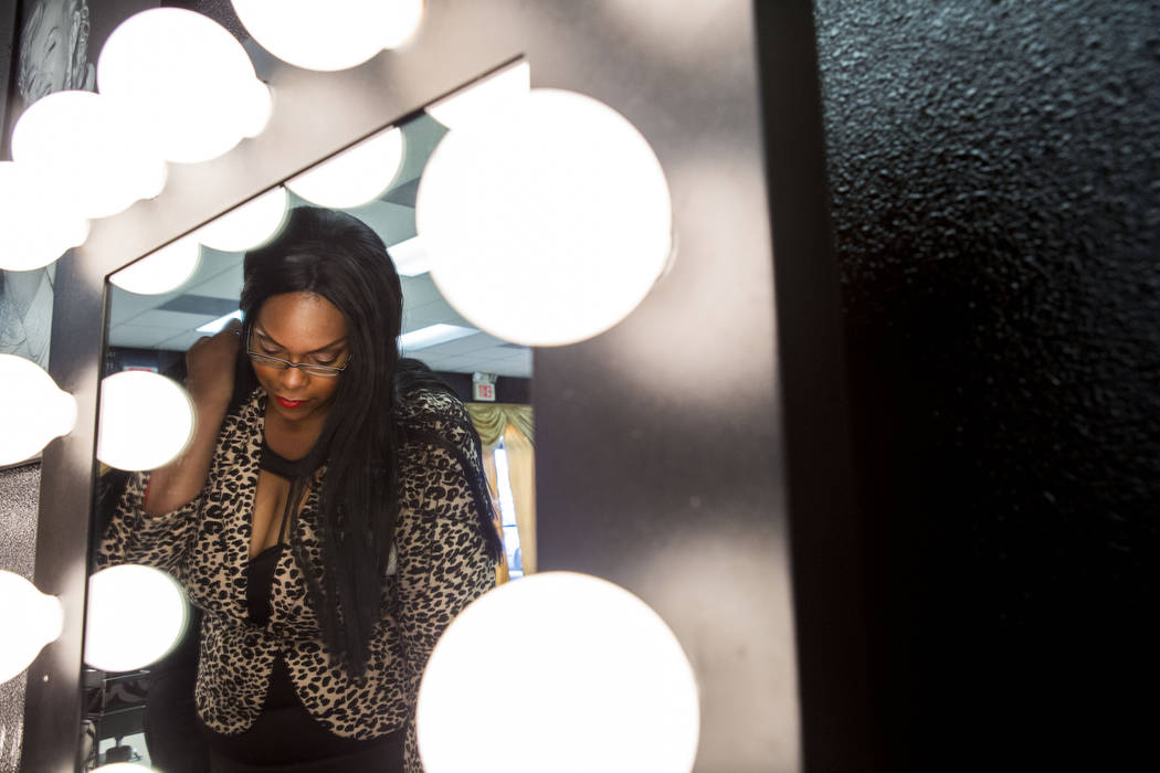 Babydoll Beauty Couture receptionist Jessica Chambers looks at makeup in the new salon catering to plus-sized women located on North Decatur Blvd. and West Lake Mead Blvd., Las Vegas, Wednesday, M ...
