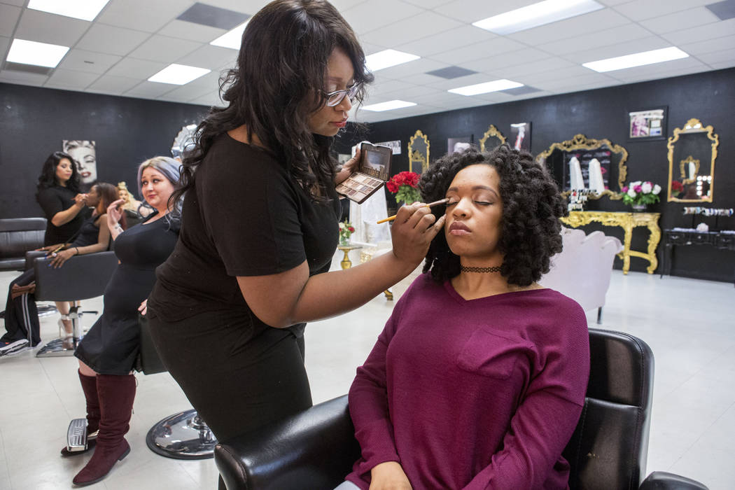 Hair and makeup artist Jessyca Wardlow-Harper works on model Breyana Wardlow at Babydoll Beauty Couture a new salon catering to plus-sized women located on North Decatur Blvd. and West Lake Mead B ...