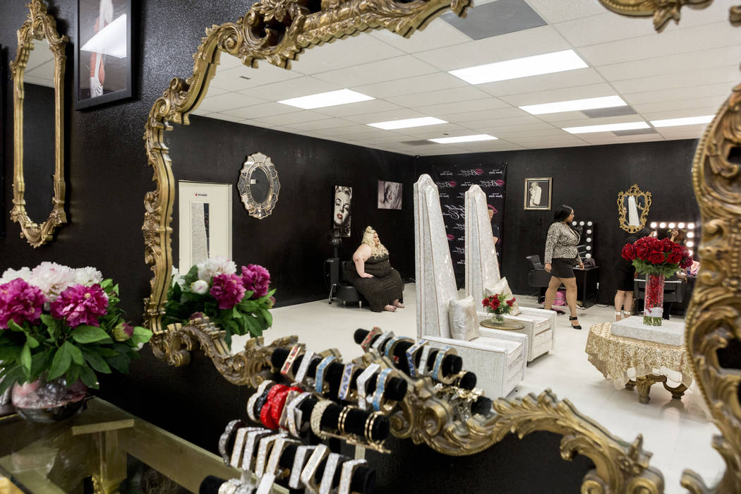 Owner of Babydoll Beauty Couture Jamie Lopez, left, and Jessica Chambers, reflect in a mirror in Lopez's new salon catering to plus-sized women located on North Decatur Blvd. and West Lake Mead Bl ...