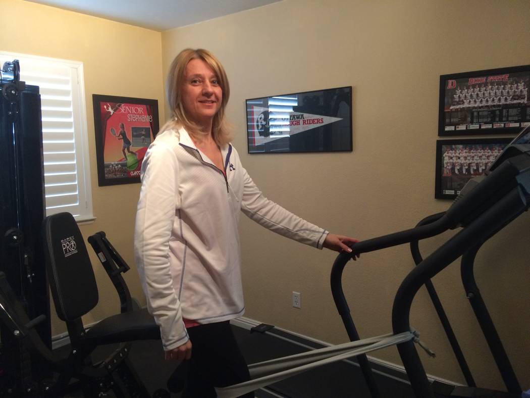 Milena Kaplan works out with stretch bands in her northwest home Feb. 22. Diagnosed in 2012, she was a regular at the gym but now uses a walker. The Cleveland Clinic Lou Ruvo Center for Brain Heal ...