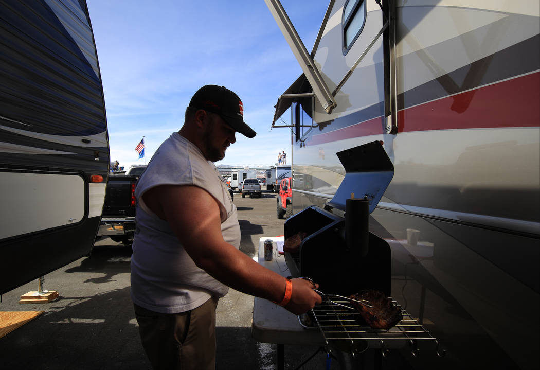 A fan cooks out during the Monster Energy NASCAR Cup Series Kobalt 400 auto race at Las Vegas Motor Speedway in Las Vegas, Sunday, March 12, 2017. (Brett Le Blanc/Las Vegas Review-Journal)