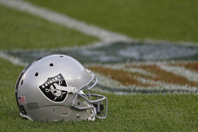 Oakland Raiders football helmet on the field prior to the start of an NFL pre-season football game between the Green Bay Packers and Oakland Raiders Friday Aug. 22, 2014, in Green Bay, Wis. (Matt  ...