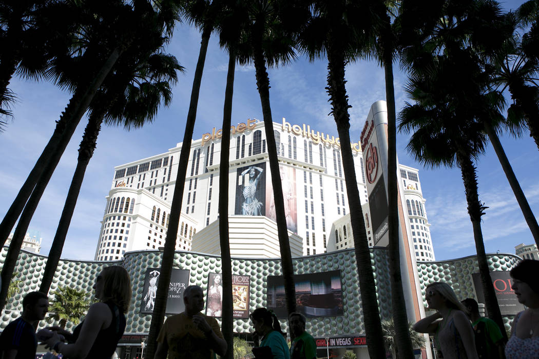 Pedestrians pass Planet Hollywood hotel-casino on the Las Vegas Strip on Friday, March 17, 2017, in Las Vegas. (Bridget Bennett/Las Vegas Review-Journal) @bridgetkb