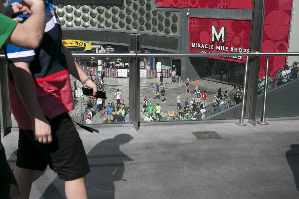 Pedestrians pass on a walkway over Las Vegas Boulevard South at West Harmon Avenue on the Las Vegas Strip on Friday, March 17, 2017, in Las Vegas. (Bridget Bennett/Las Vegas Review-Journal) @bridgetkb