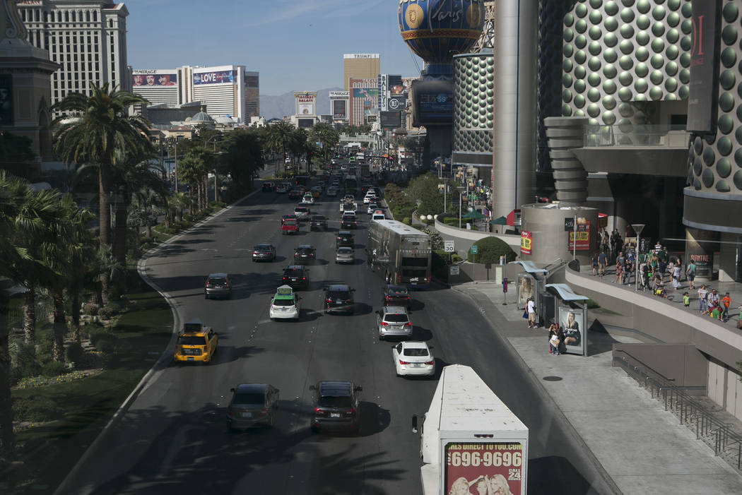 Crowds of pedestrians are seen bordering Las Vegas Boulevard South as seen from a walkway at West Harmon Avenue on the Las Vegas Strip on Friday, March 17, 2017, in Las Vegas. (Bridget Bennett/Las ...