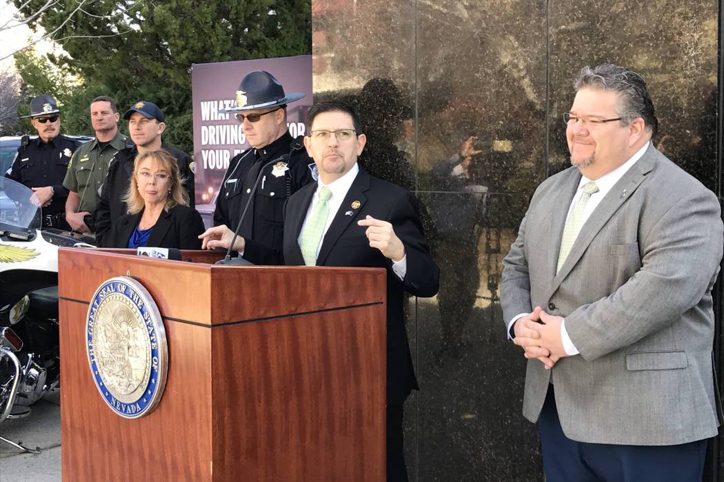 Sen. Mark Manendo, center, and Assemblyman Richard Carrillo, right, discuss Senate Bill 259 requiring ignition interlocks for DUI offenders at a press conference Friday, March 17, 2017 in Carson C ...