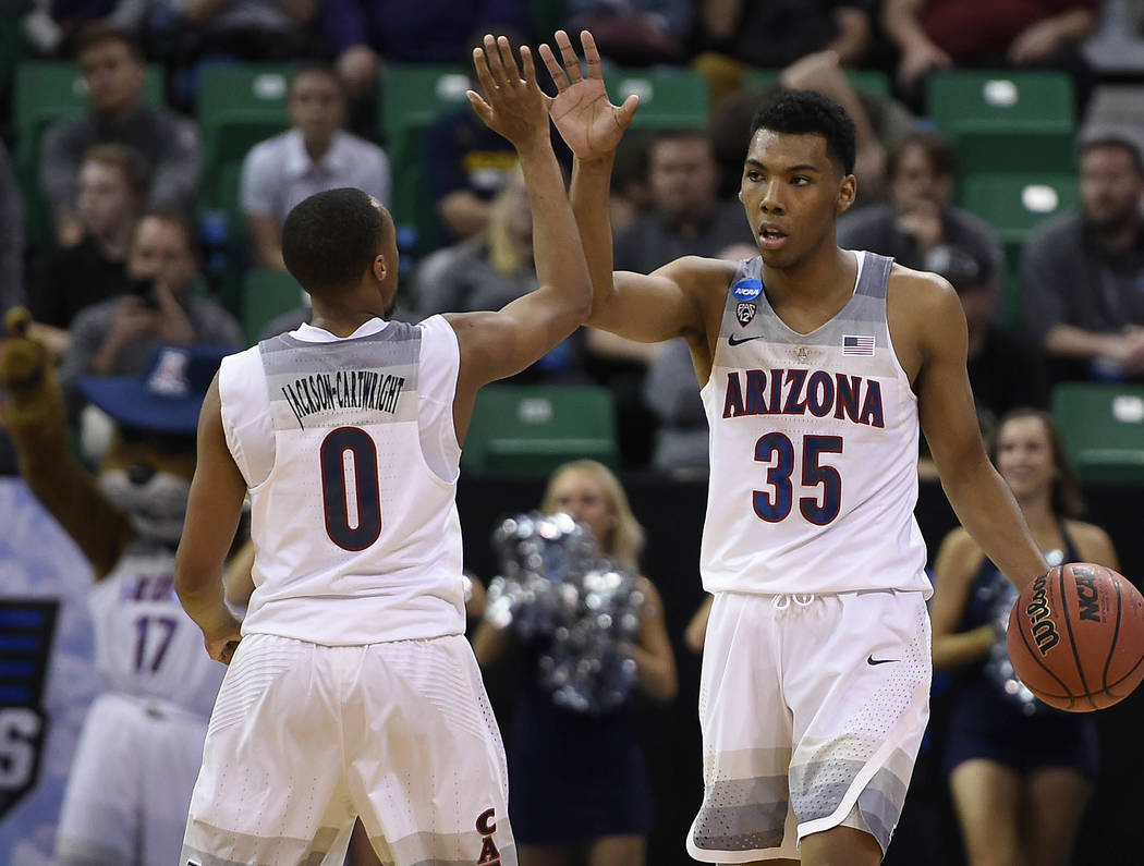 March 18, 2017; Salt Lake City, UT, USA; Arizona Wildcats guard Allonzo Trier (35) and guard Parker Jackson-Cartwright (0) react during the 69-60 victory against the Saint Mary's Gaels in the seco ...