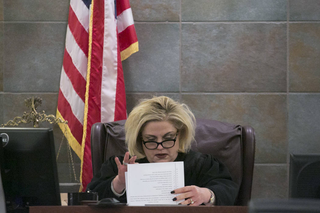 District Judge Michelle Leavitt pages through papers prior to the reading of Javier Righetti's sentencing at the Regional Justice Center on Tuesday, March 21, 2017, in Las Vegas. Righetti was sent ...