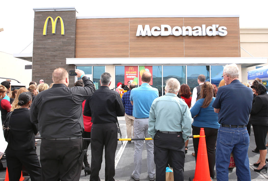 People gather outside McDonald's restaurant during the reopening ceremony on Sunset Road and Durango Drive on Wednesday, March 22, 2017, in Las Vegas. The store will be the first McDonaldճ i ...