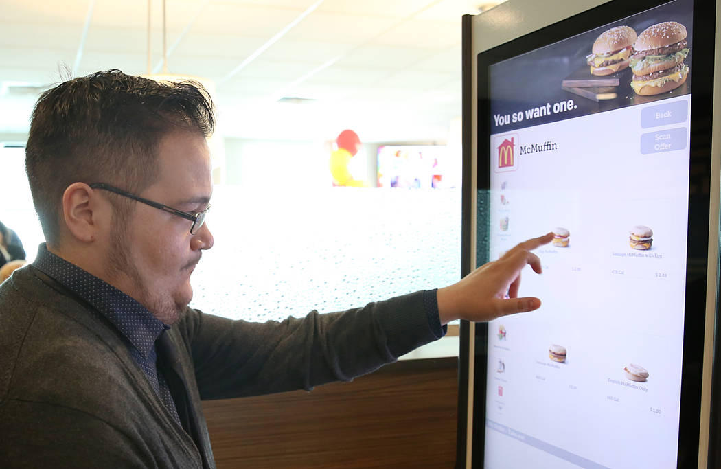 Isaiah Sandoval places his order at a self-service kiosk at McDonald's restaurant on Sunset Road and Durango Drive on Wednesday, March 22, 2017, in Las Vegas. The store will be the first McDonald& ...