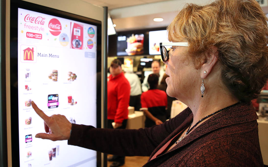Hilde Hethcote places her order at a self-service kiosk at McDonald's restaurant on Sunset Road and Durango Drive on Wednesday, March 22, 2017, in Las Vegas. The store will be the first McDonald&# ...