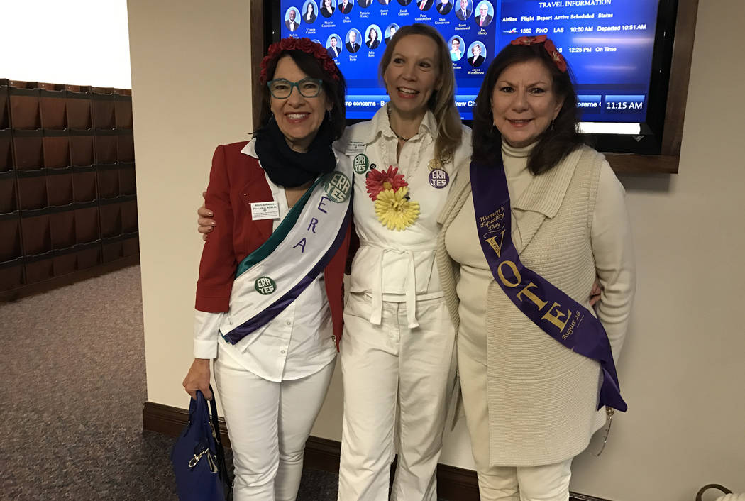 From left, Sarah Mahler, Janette Dean and Pat Lynch, wore sashes and buttons Wednesday, March 22, 2017, in the state Legislature as the Nevada Senate prepared to give final approval to ratifying t ...