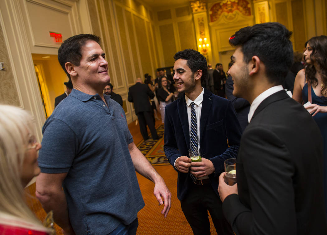 Entrepreneur Mark Cuban, left, talks with Kevin Larian and David Poura while  attending the Adelson Educational Campus' 13th annual In Pursuit of Excellence Gala at The Venetian hotel-casino in La ...