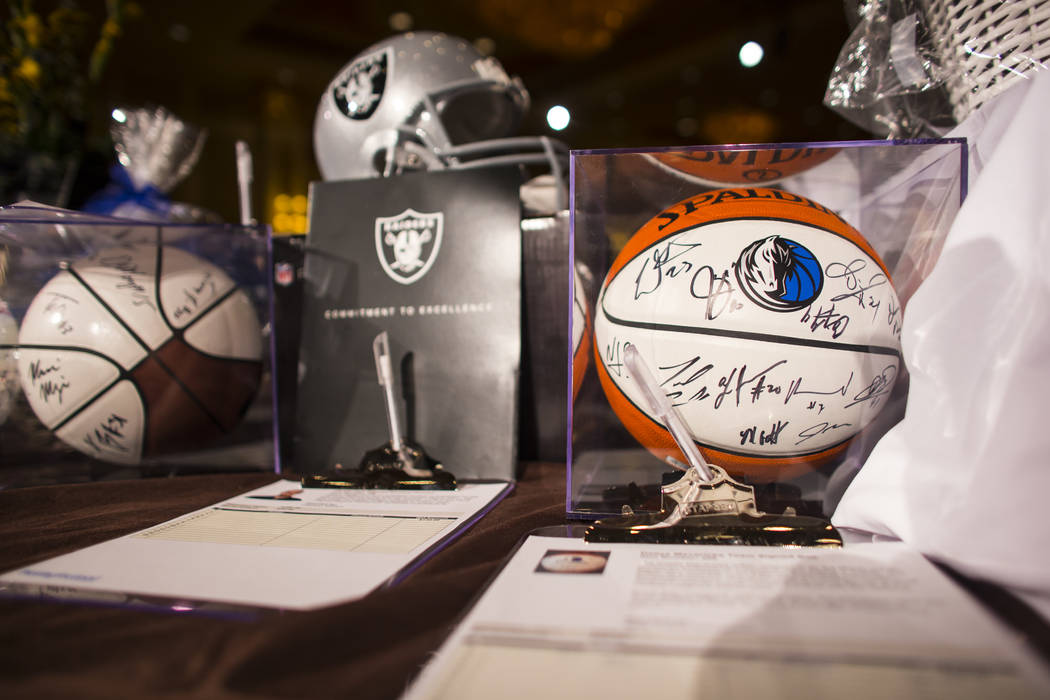 A ball signed by members of the Dallas Mavericks is shown at the silent auction during the Adelson Educational Campus' 13th annual In Pursuit of Excellence Gala at The Venetian hotel-casino in Las ...