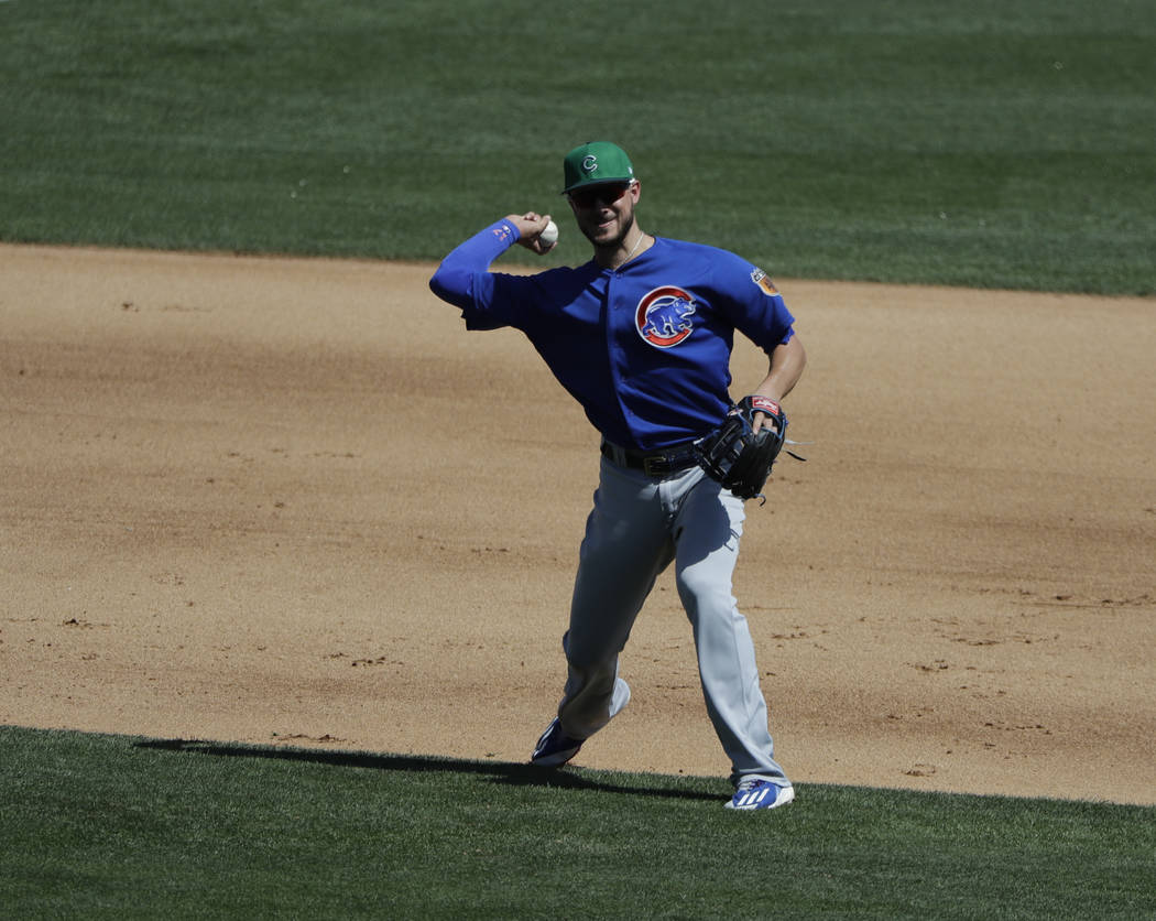 Chicago Cubs' Kris Bryant throws during a spring training baseball game against the Chicago White Sox, Friday, March 17, 2017, in Phoenix. (AP Photo/Darron Cummings)