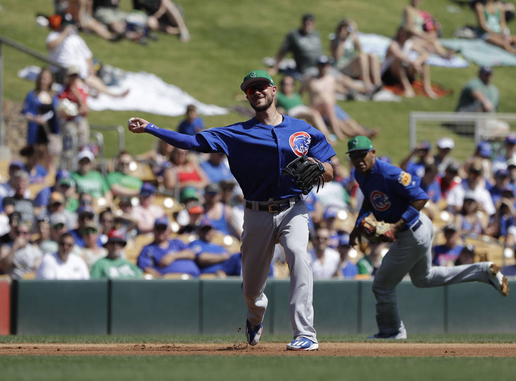 Chicago Cubs' Kris Bryant throws during a spring training baseball game against the Chicago White Sox, Friday, March 17, 2017, in Phoenix. (AP Photo/Darron Cummings)